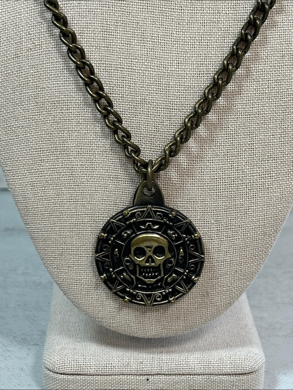 bronze-finished Disney Pirates of the Caribbean Aztec skull coin necklace
